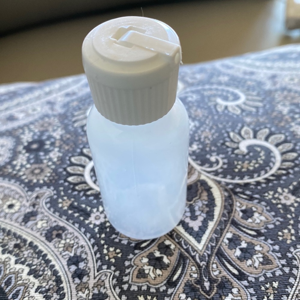 New 1 ounce travel bottle squeezable